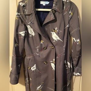 Boden trench coat. Brown background with bird print